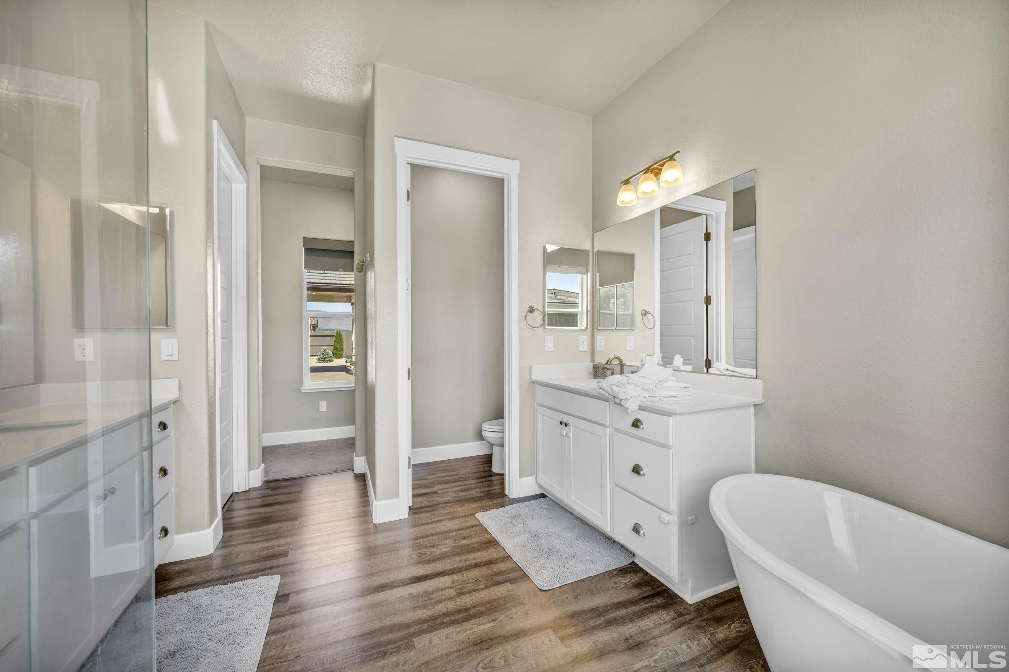 1237 Crawford Crk Drive Reno, NV 89521 - Photo 14 of 39 a spacious bathroom with a granite countertop tub sink and mirror