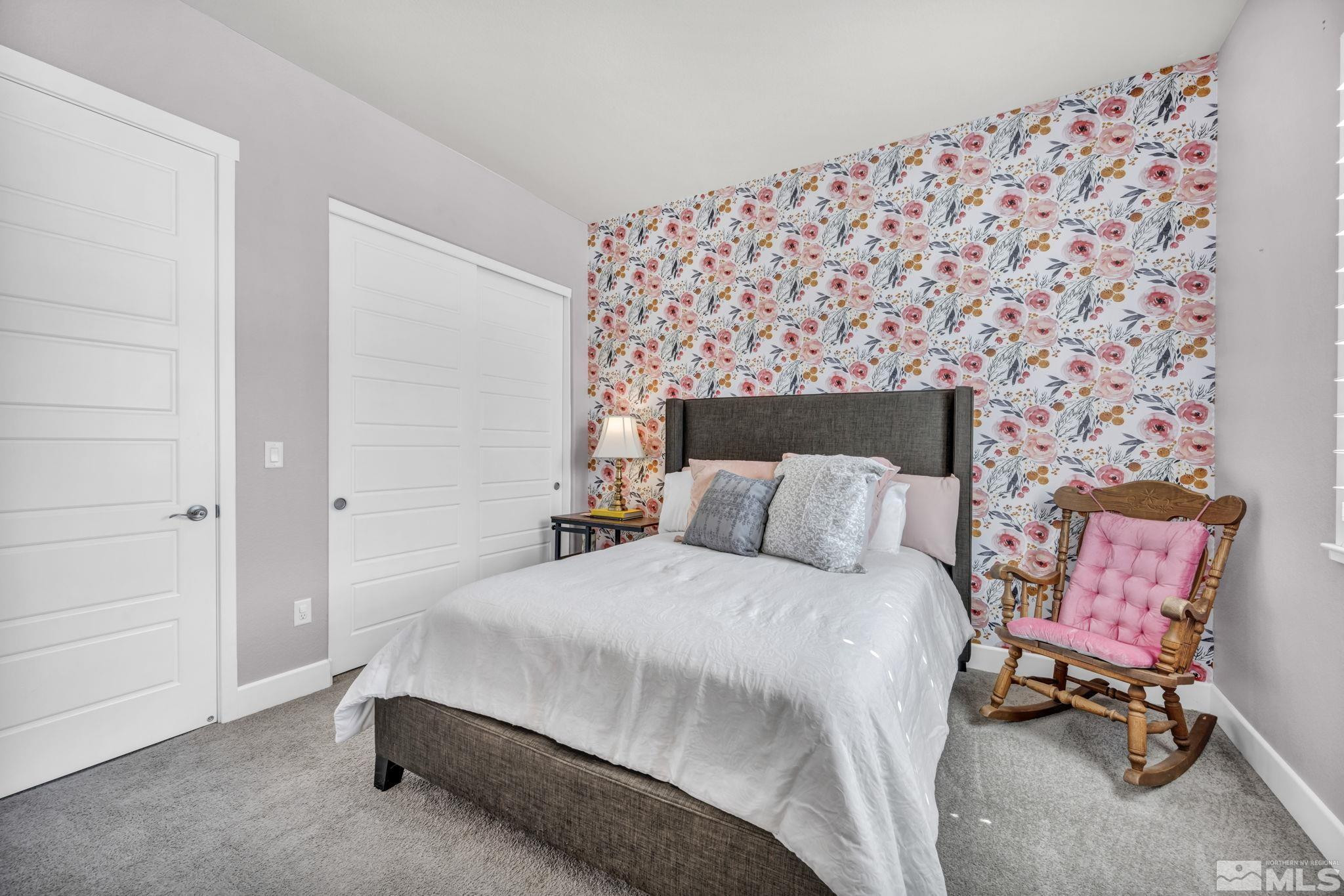 1237 Crawford Crk Drive Reno, NV 89521 - Photo 17 of 39 a bedroom with a bed and a chair