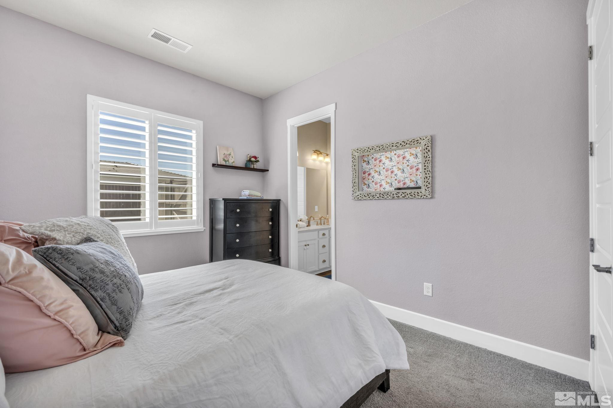 1237 Crawford Crk Drive Reno, NV 89521 - Photo 18 of 39 a bedroom with a bed and a window
