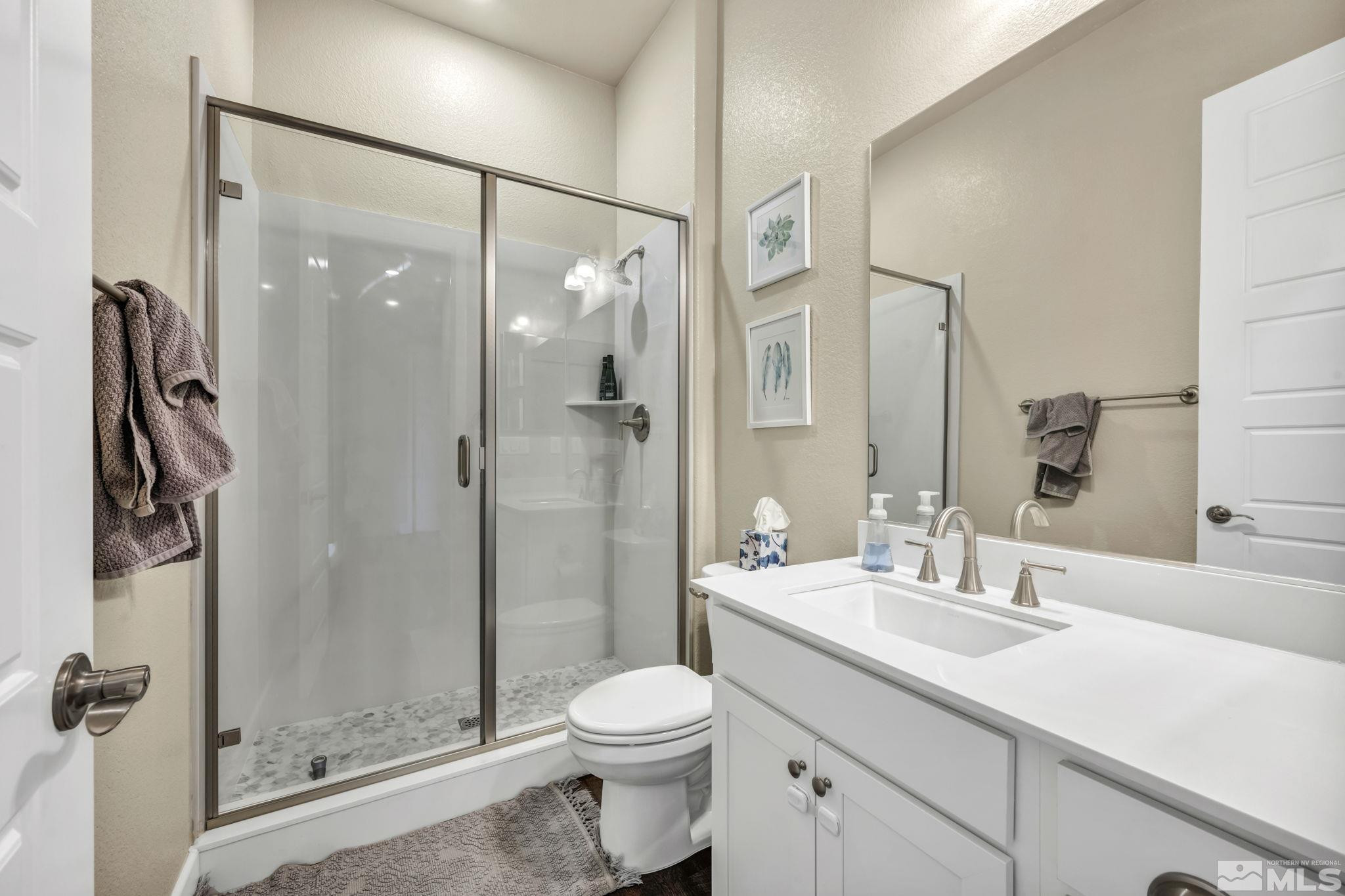 1237 Crawford Crk Drive Reno, NV 89521 - Photo 19 of 39 a bathroom with a sink toilet and shower