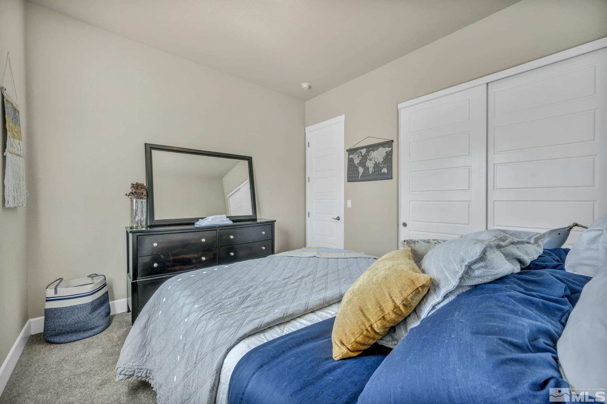 1237 Crawford Crk Drive Reno, NV 89521 - Photo 21 of 39 a bedroom with a bed and wooden floor