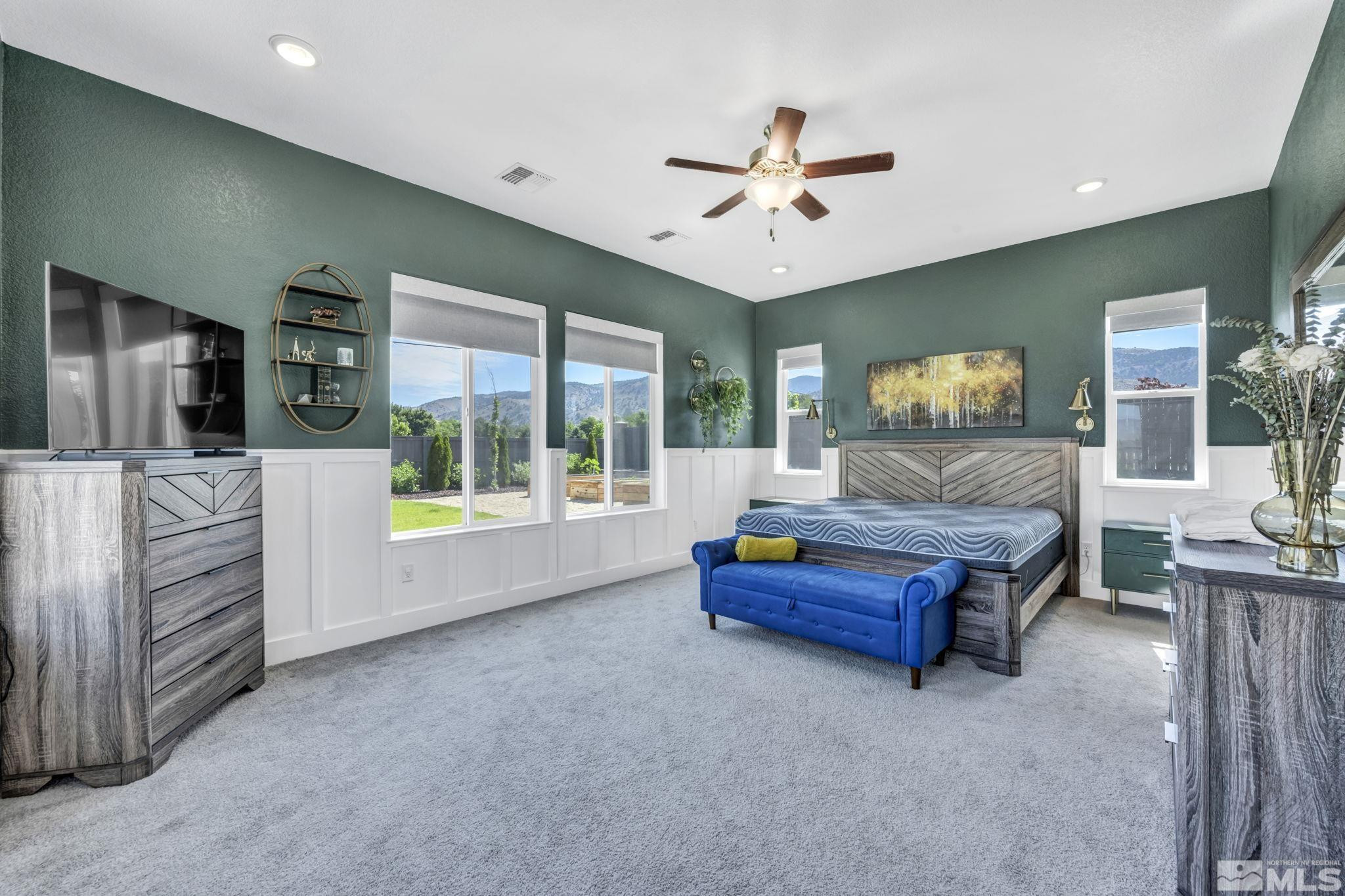 1237 Crawford Crk Drive Reno, NV 89521 - Photo 23 of 39 a bedroom with a bed and a chandelier