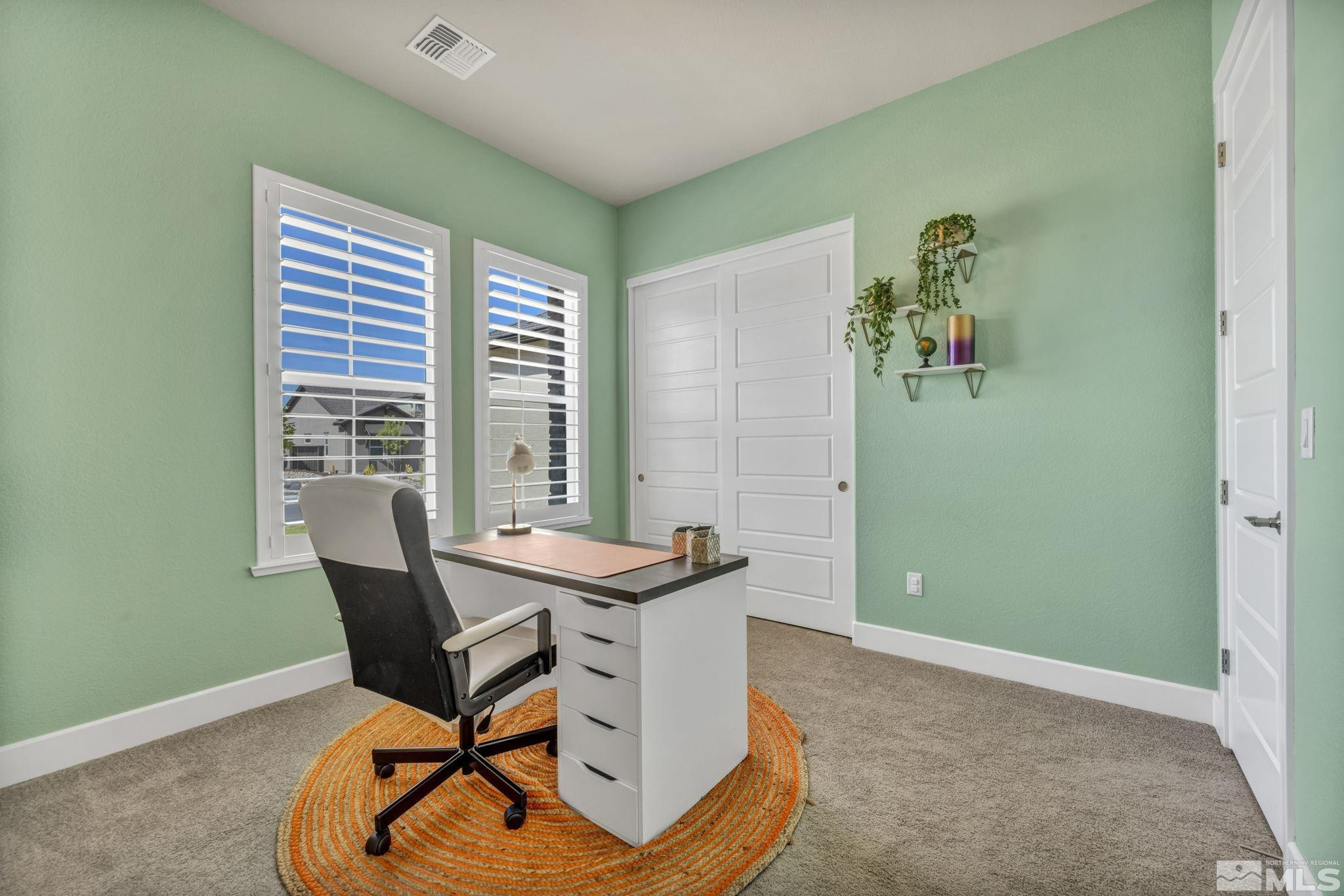 1237 Crawford Crk Drive Reno, NV 89521 - Photo 26 of 39 a view of a workspace with furniture and a window