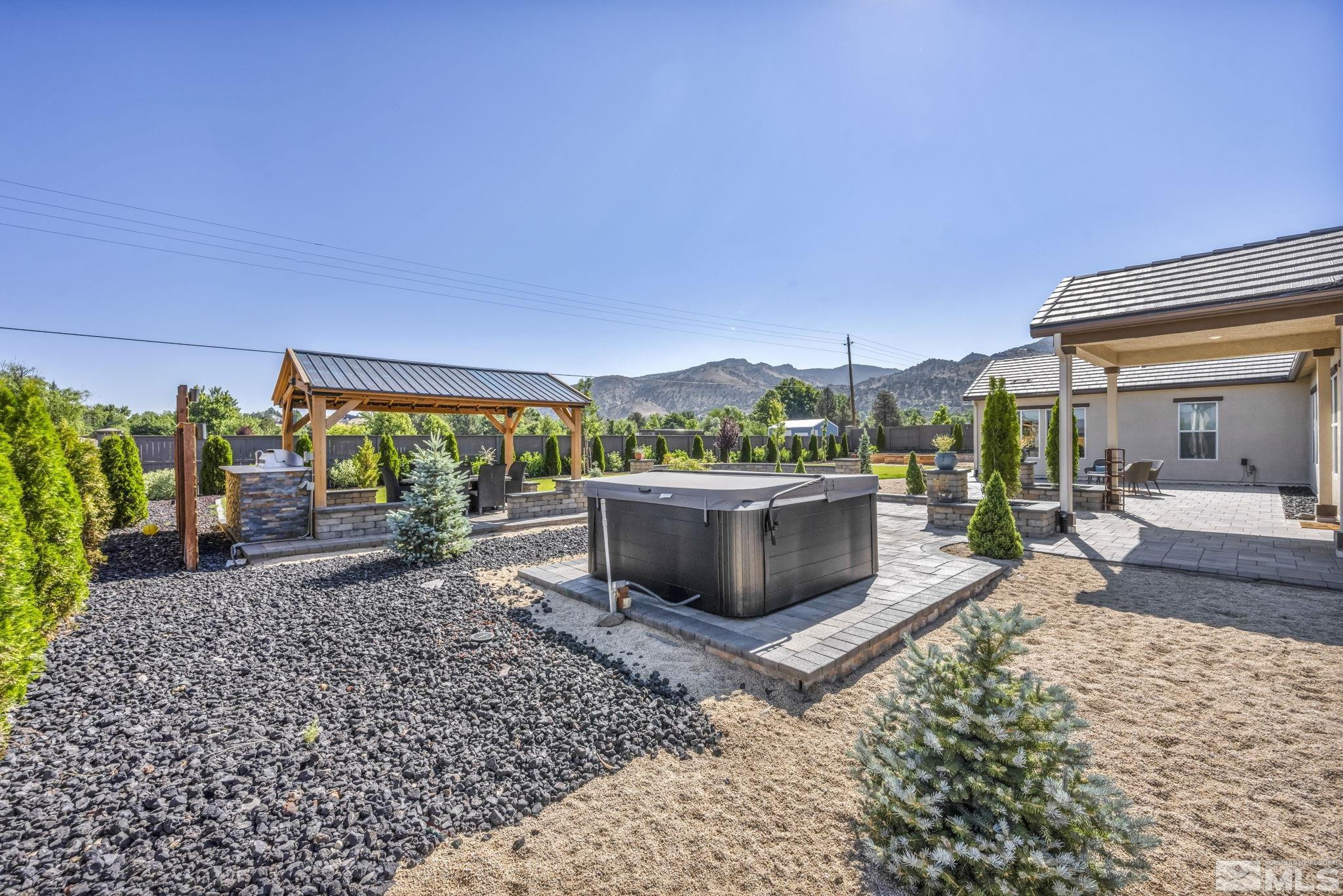 1237 Crawford Crk Drive Reno, NV 89521 - Photo 32 of 39 a view of a house with a yard and sitting area