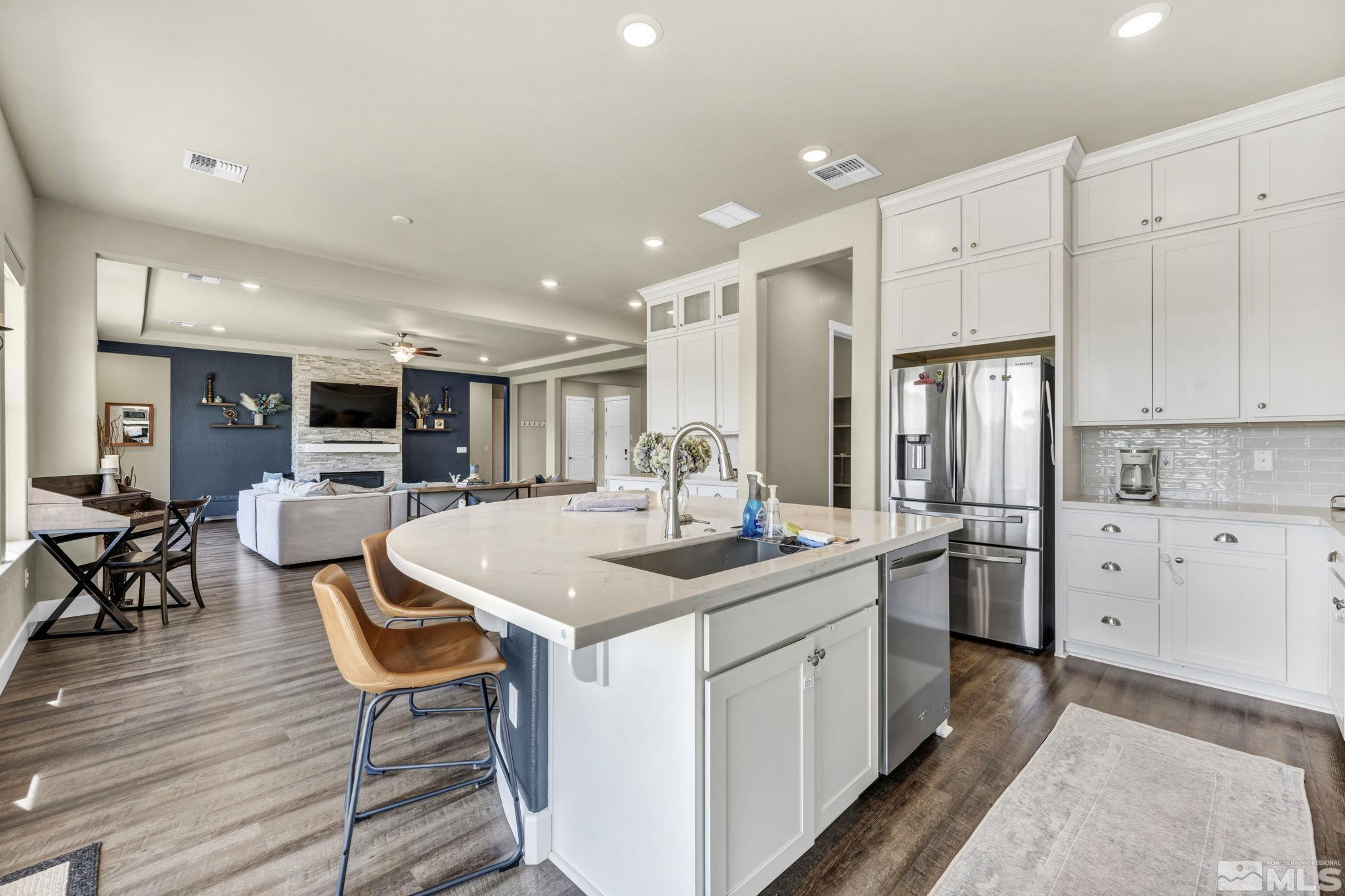1237 Crawford Crk Drive Reno, NV 89521 - Photo 5 of 39 a kitchen with stainless steel appliances granite countertop a sink and cabinets
