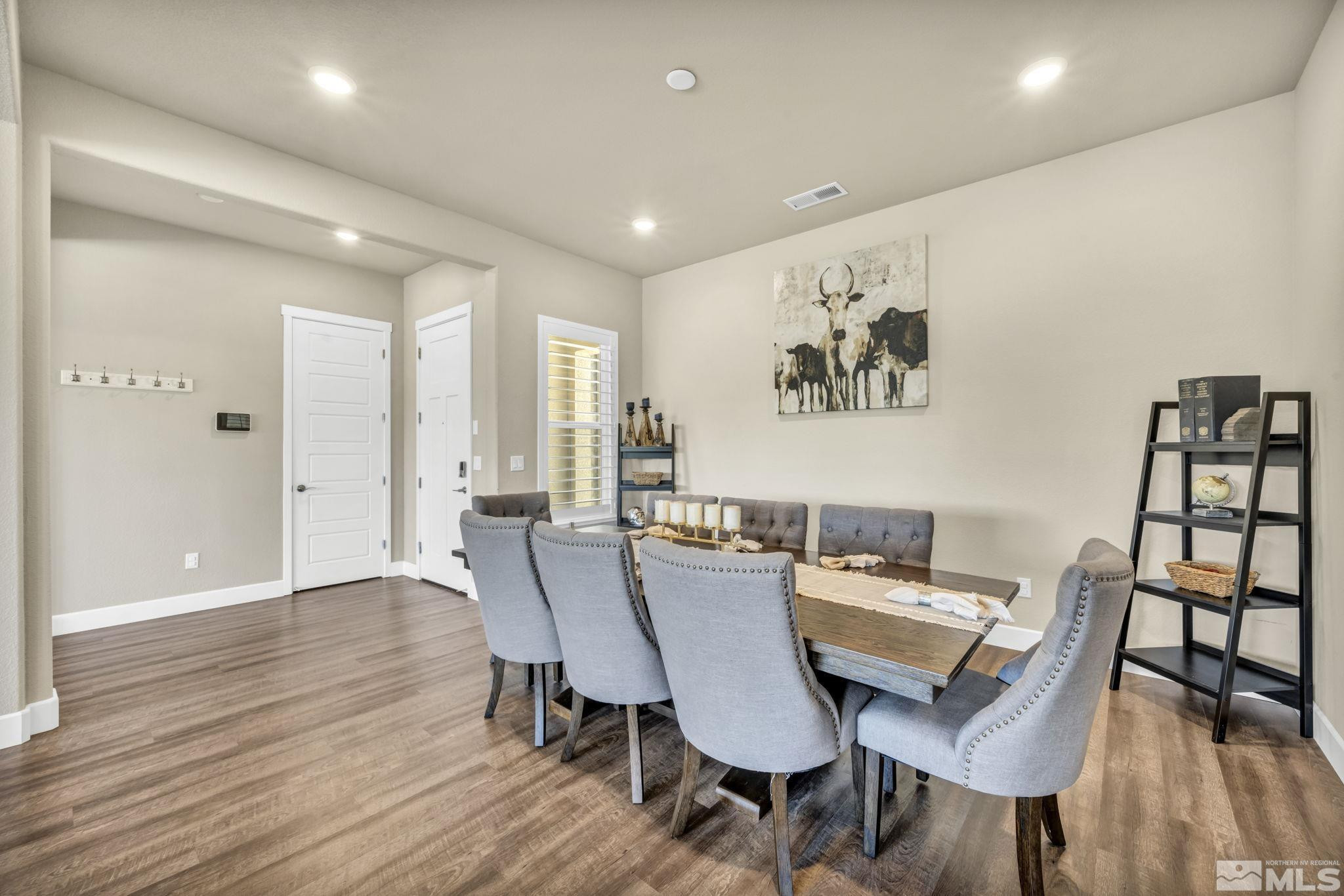 1237 Crawford Crk Drive Reno, NV 89521 - Photo 10 of 39 a view of a dining room with furniture and wooden floor