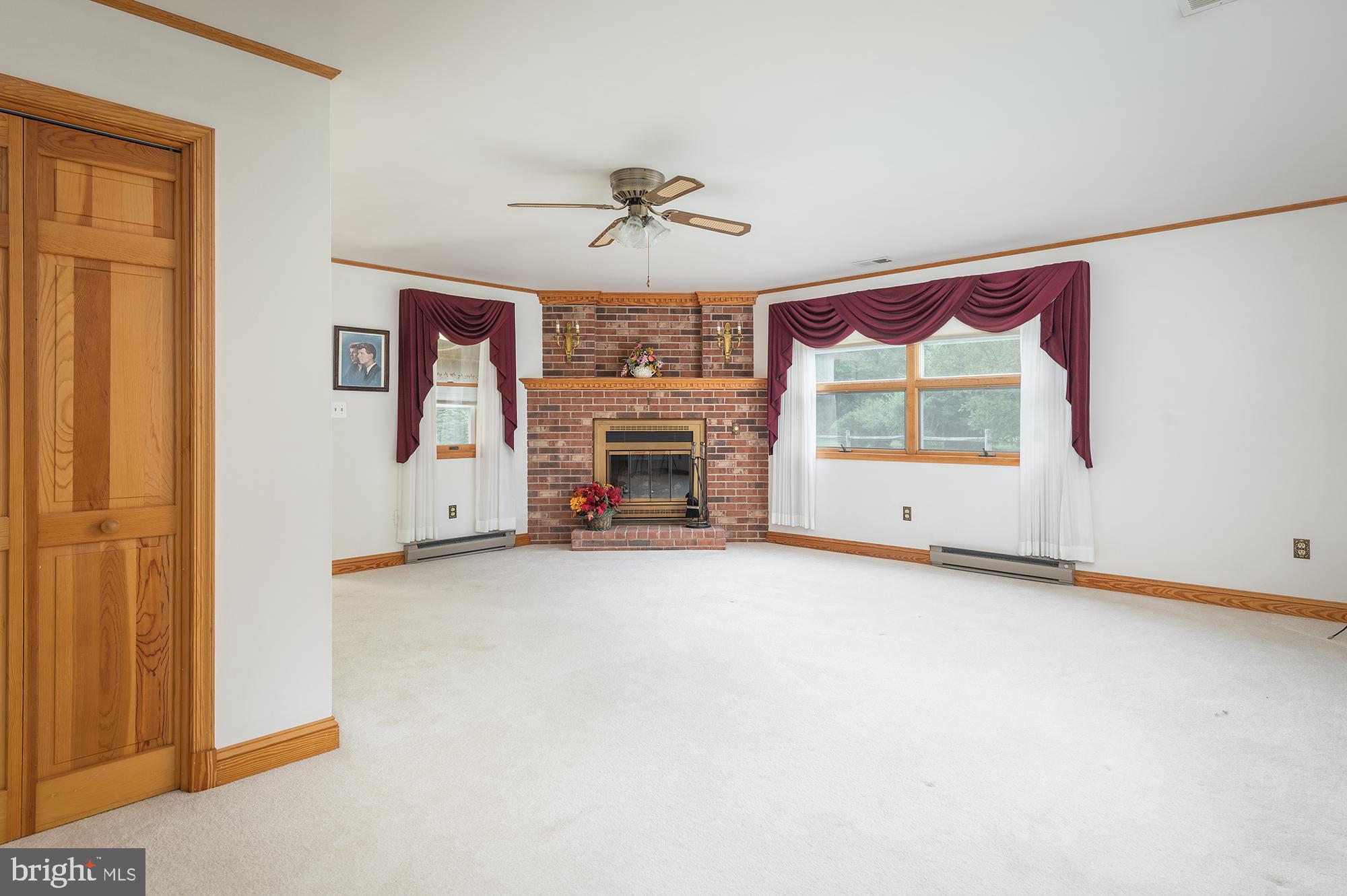 5615 Cullum Road White Marsh, MD 21162 - Photo 11 of 28 Living room with wood burning fireplace