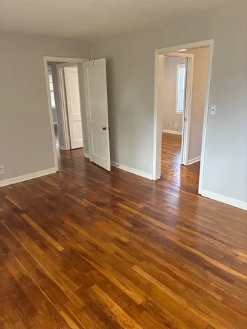 a kitchen with granite countertop a sink and a stove top oven