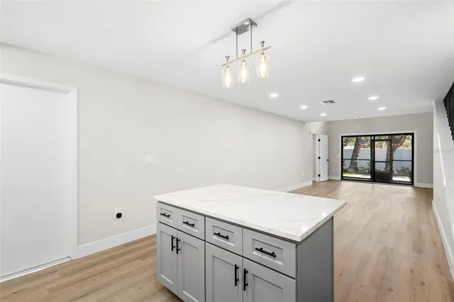 a kitchen with a stove a sink and a refrigerator