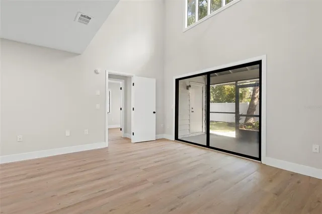 wooden floor in an empty room with a window