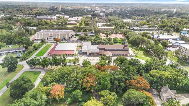 an aerial view of residential houses with city view