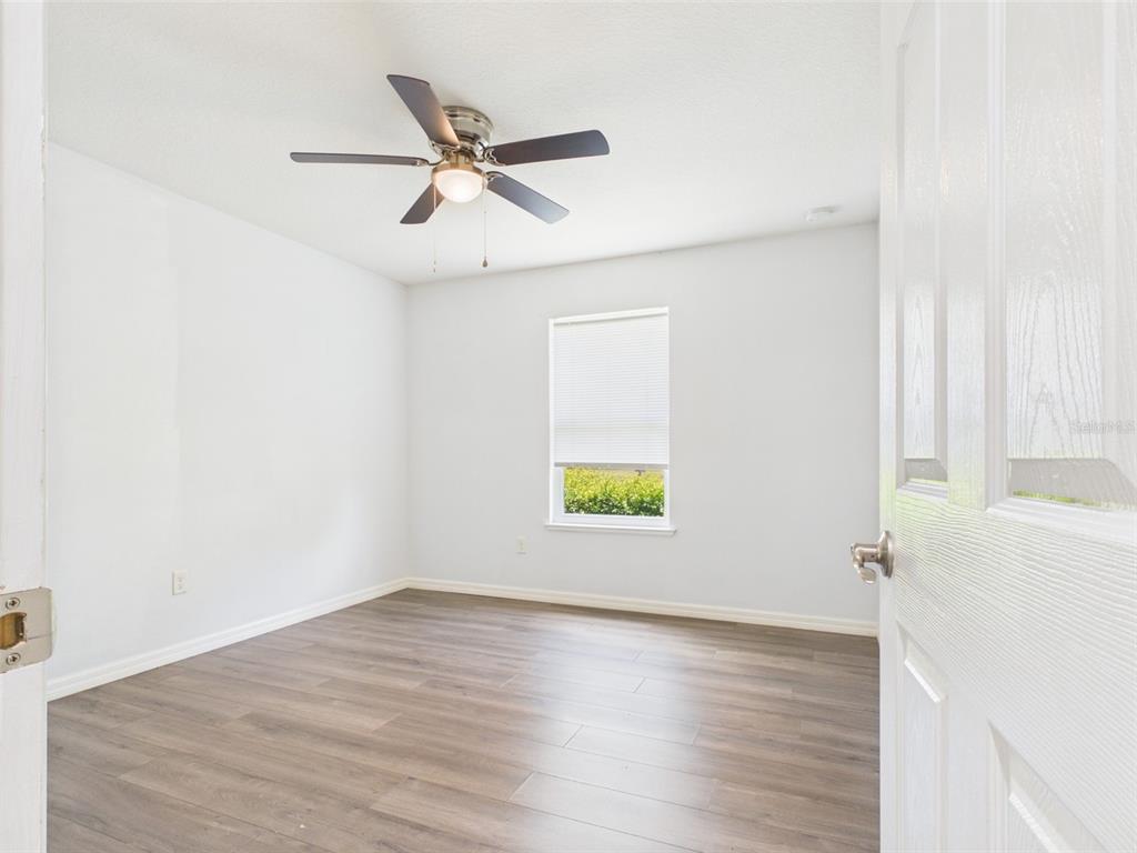4309 Southwest 143rd Ln Road Ocala, FL 34473 - Photo 12 of 21 a view of an entryway with wooden floor