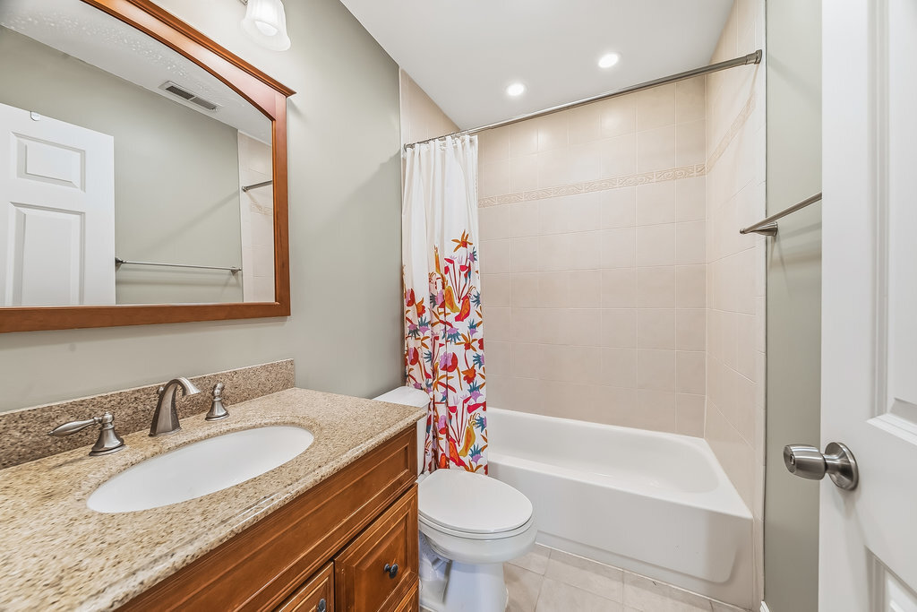 9512 Birch Avenue Mokena, IL 60448 - Photo 12 of 17 a bathroom with a granite countertop sink toilet and shower