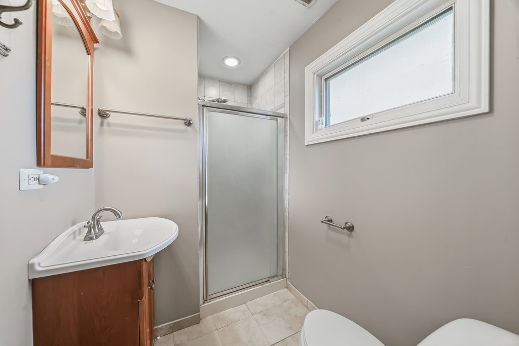 9512 Birch Avenue Mokena, IL 60448 - Photo 14 of 17 a bathroom with a sink mirror and toilet