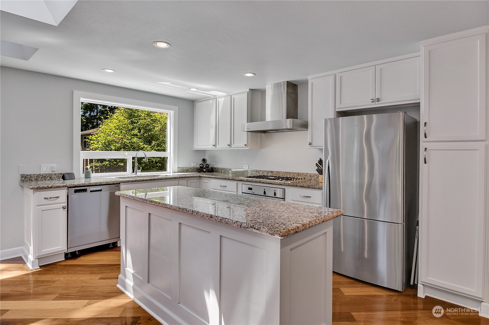 24227 4th Place West Bothell, WA 98021 - Photo 12 of 31 a kitchen with stainless steel appliances granite countertop a refrigerator sink and cabinets