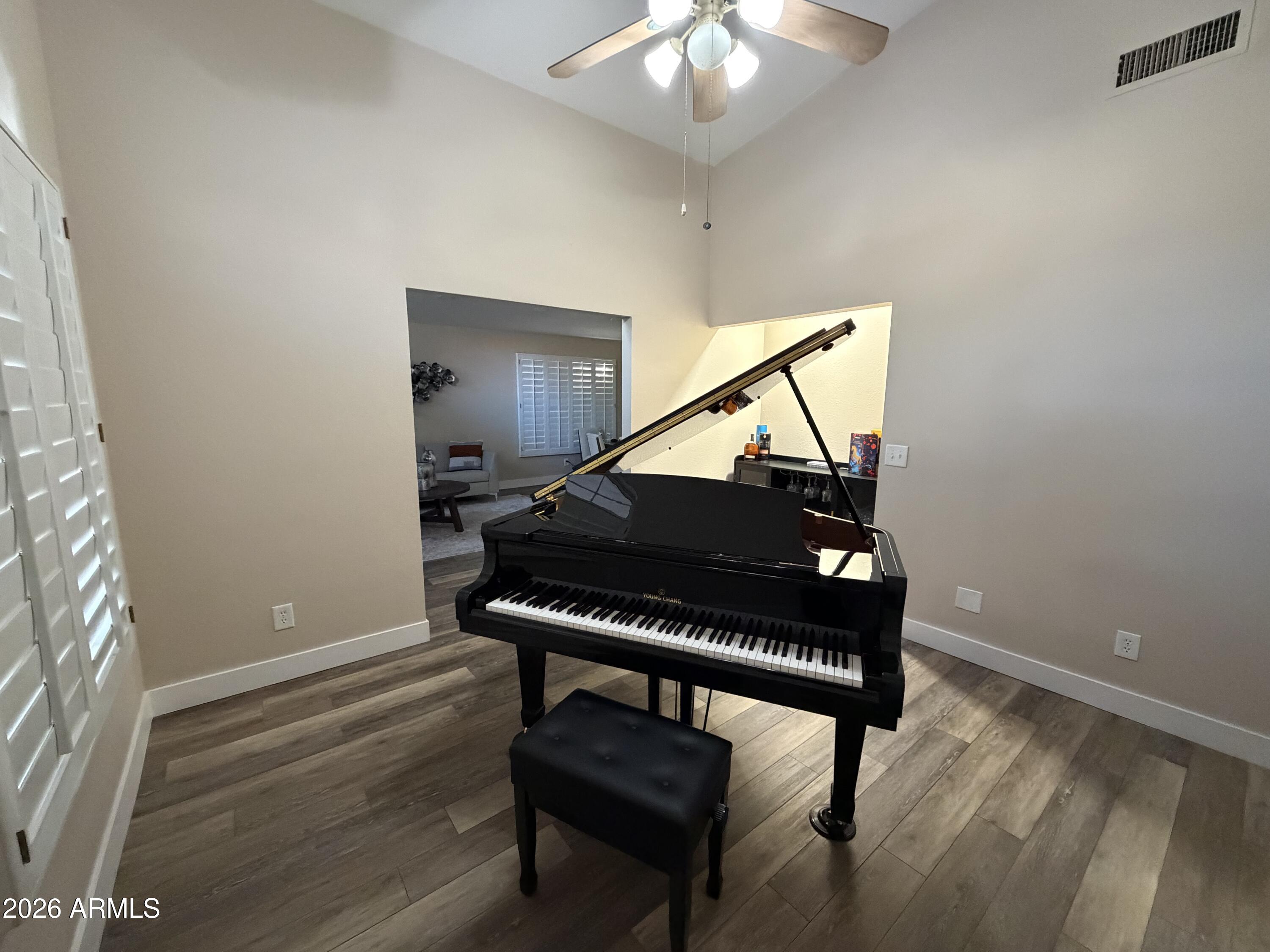 473 West Smoke Tree Road Gilbert, AZ 85233 - Photo 11 of 41 a living room with furniture and a piano