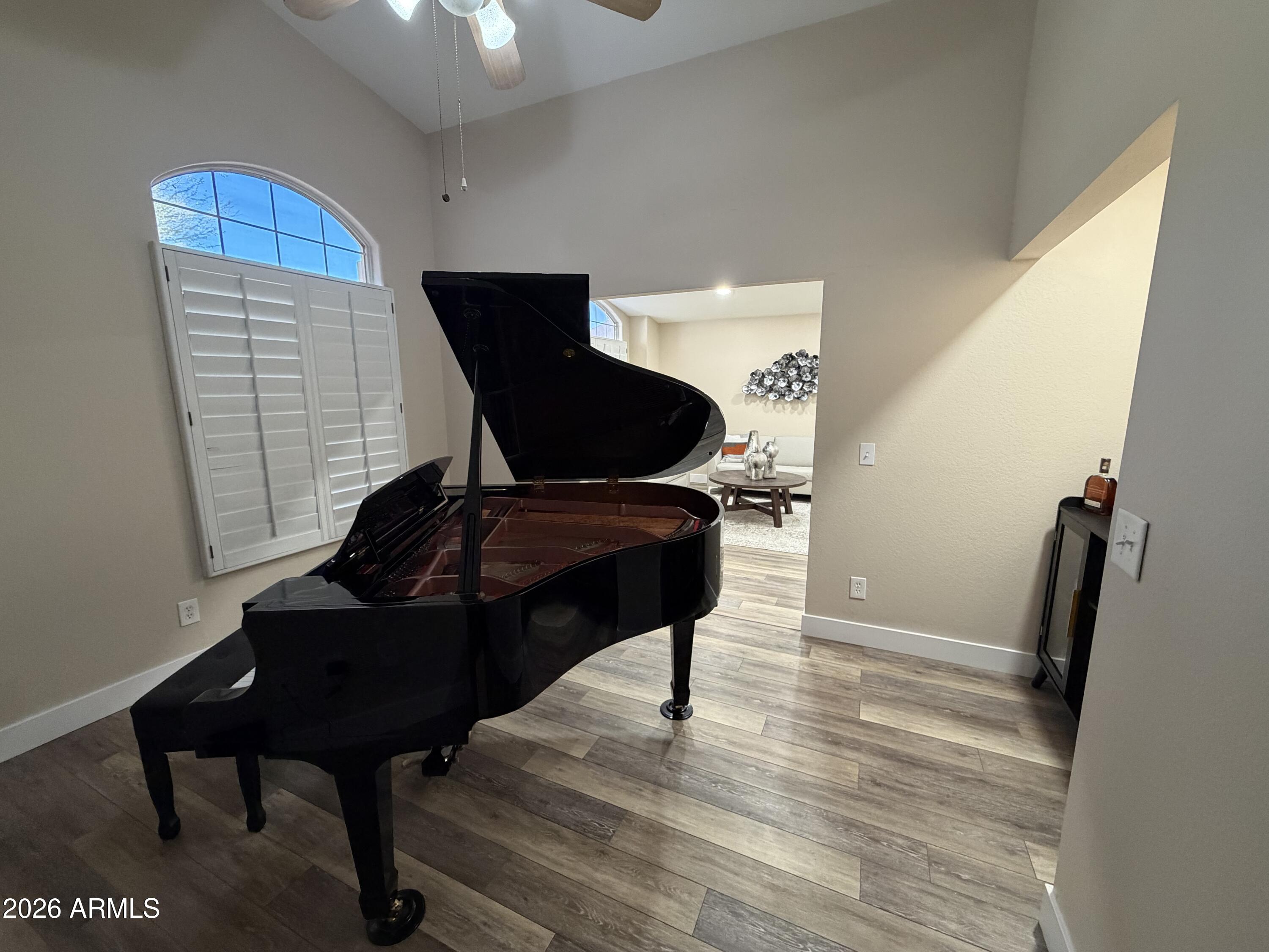 473 West Smoke Tree Road Gilbert, AZ 85233 - Photo 12 of 41 a view of a workspace with furniture and wooden floor