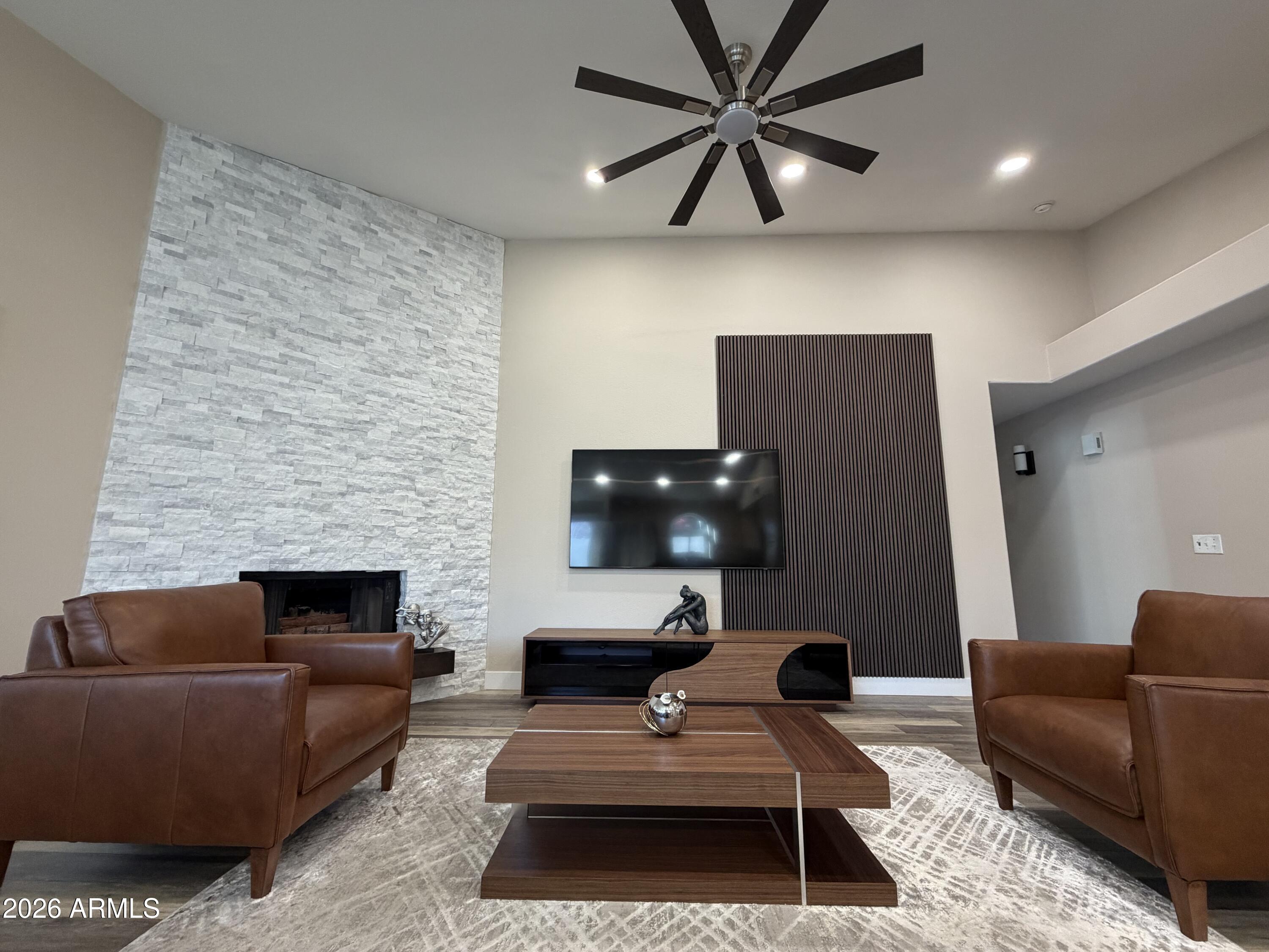 473 West Smoke Tree Road Gilbert, AZ 85233 - Photo 14 of 41 a living room with furniture and a fireplace