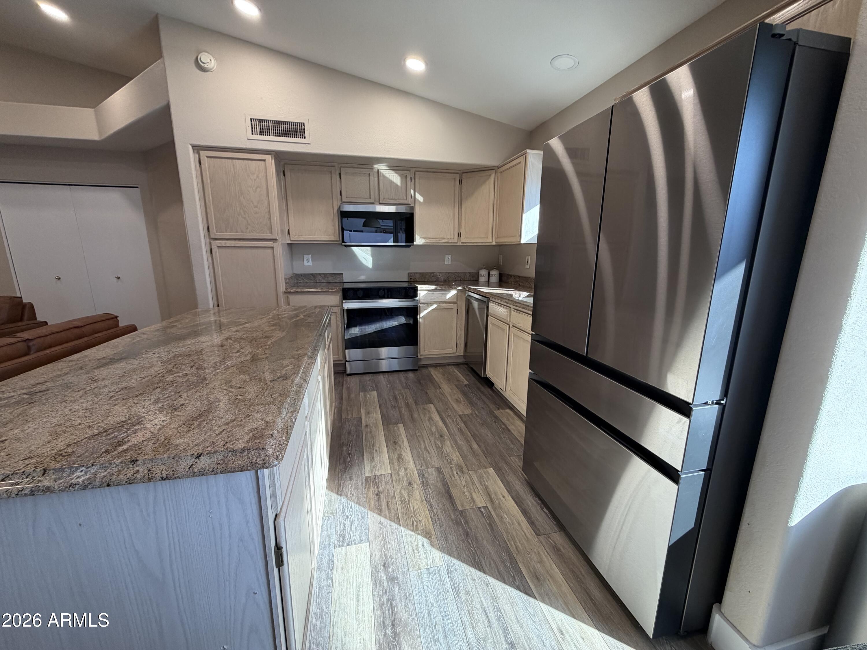 473 West Smoke Tree Road Gilbert, AZ 85233 - Photo 17 of 41 a kitchen with refrigerator a microwave and stove