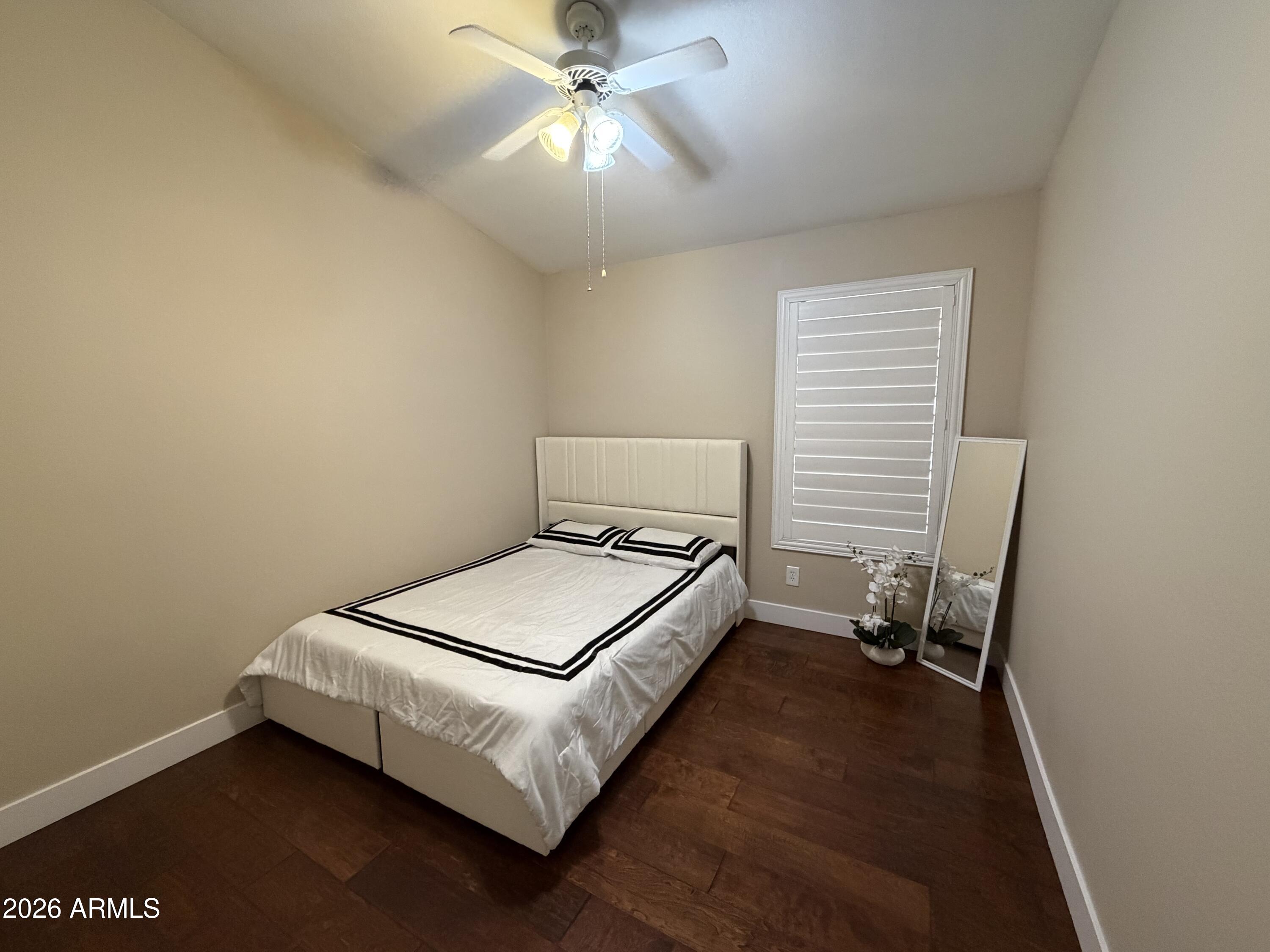 473 West Smoke Tree Road Gilbert, AZ 85233 - Photo 26 of 41 a bedroom with a bed and a ceiling fan