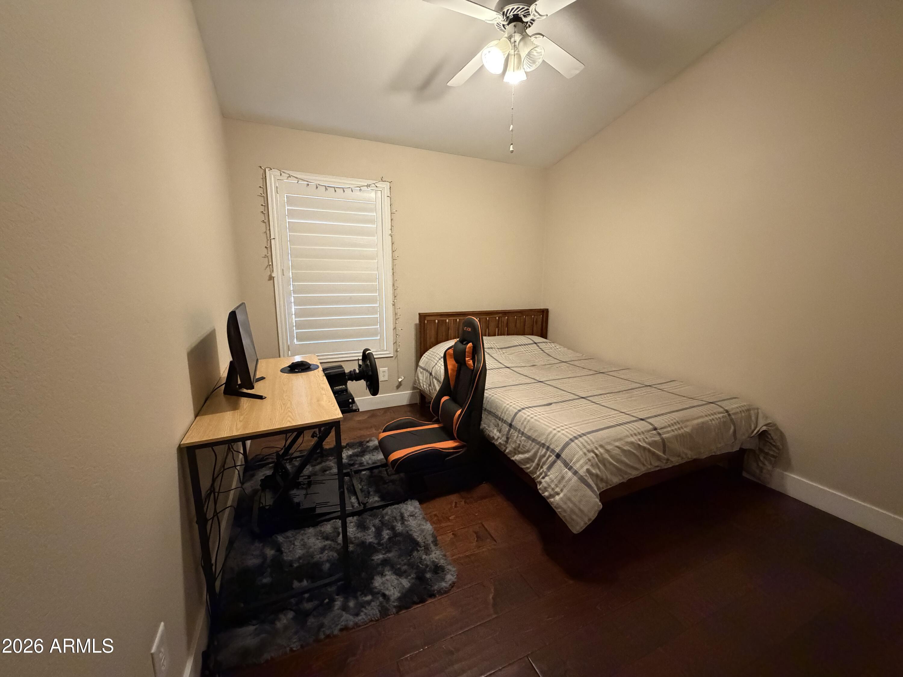 473 West Smoke Tree Road Gilbert, AZ 85233 - Photo 28 of 41 a bedroom with a bed and a chandelier