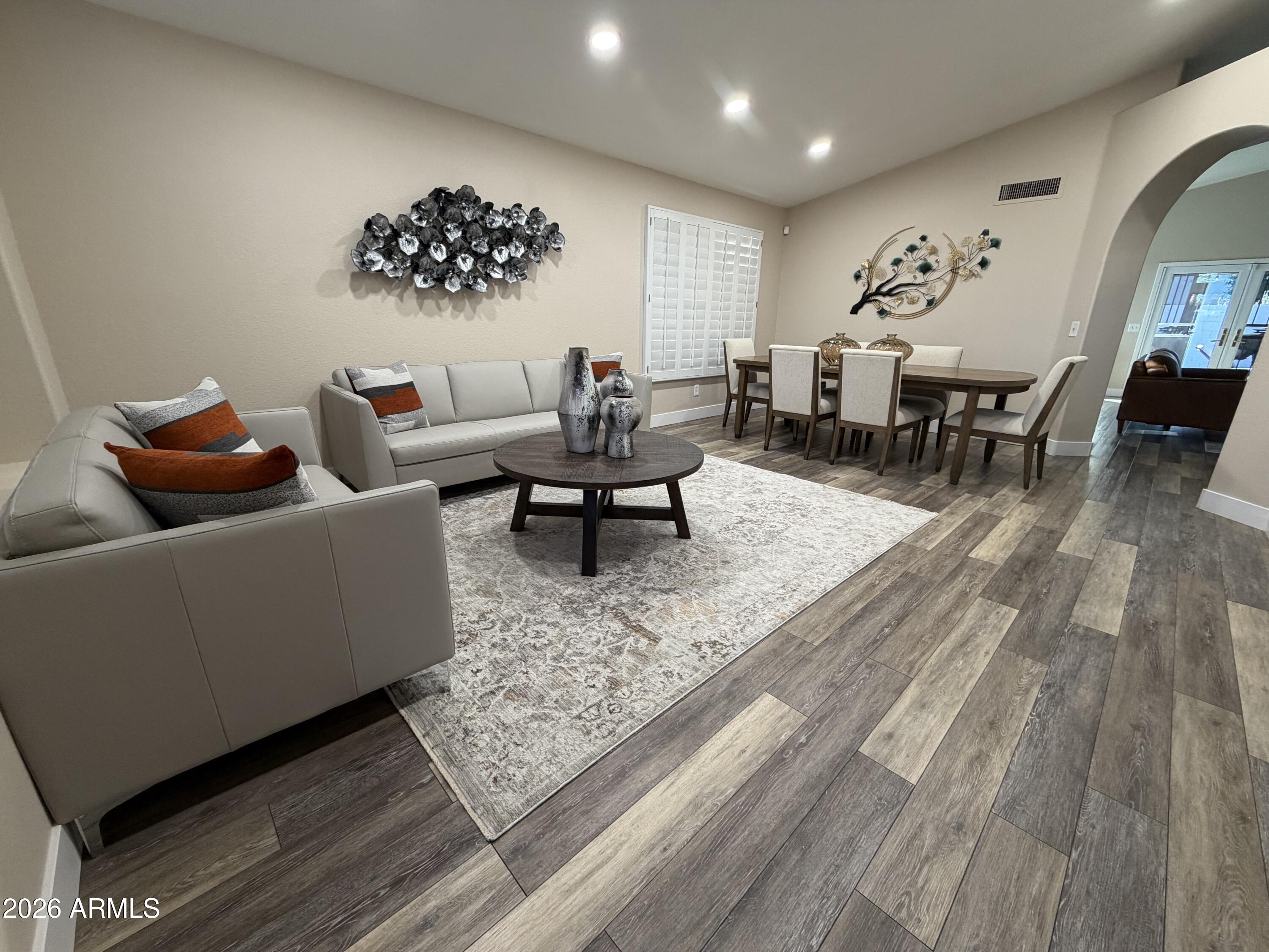 473 West Smoke Tree Road Gilbert, AZ 85233 - Photo 6 of 41 a living room with furniture and wooden floor