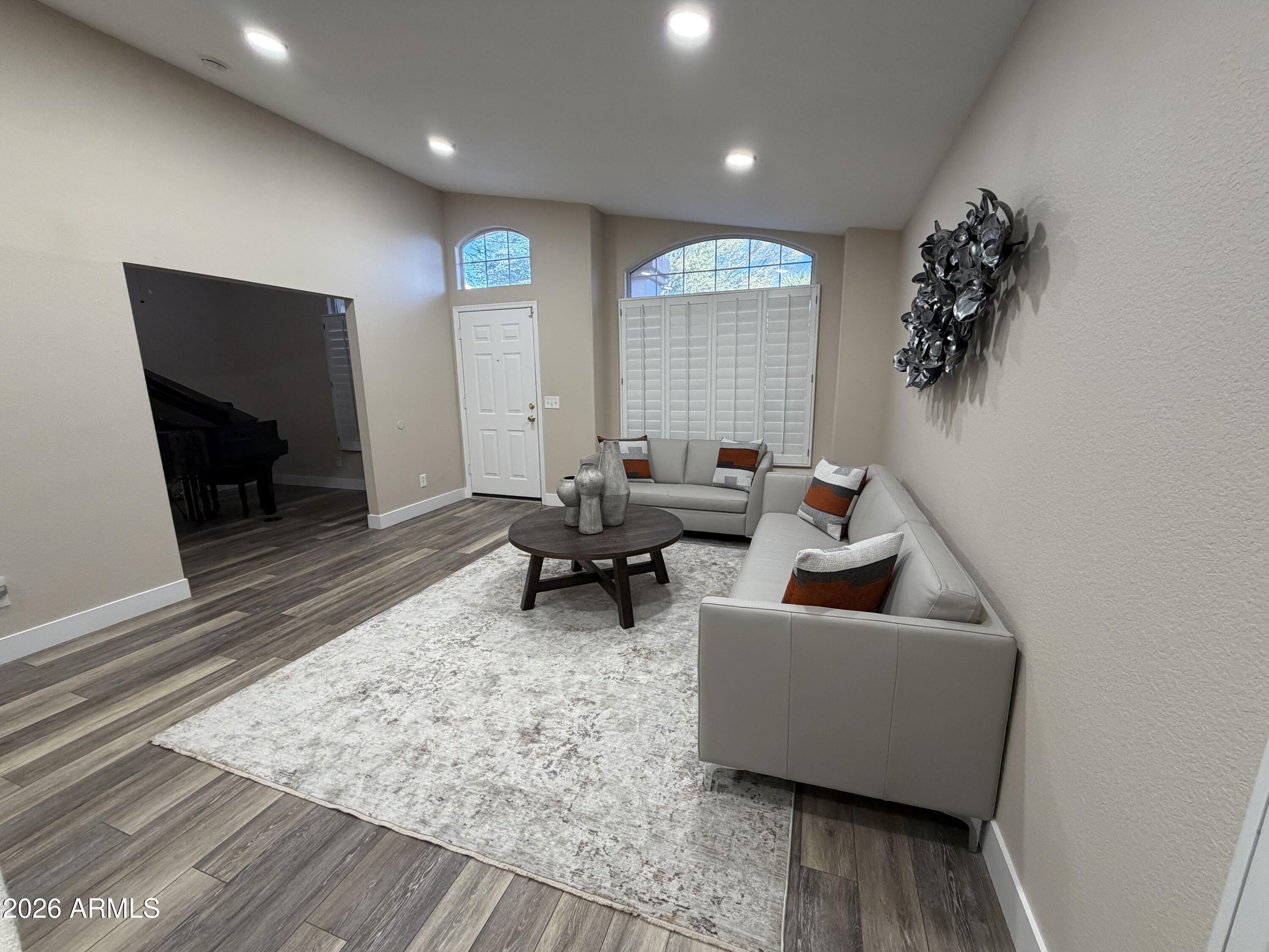 473 West Smoke Tree Road Gilbert, AZ 85233 - Photo 10 of 41 a living room with furniture and a rug