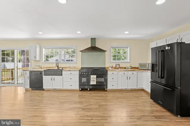 a kitchen with stainless steel appliances a refrigerator and a stove