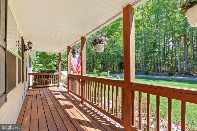 a view of balcony with wooden floor