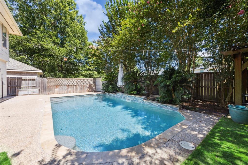 6 Wimberly Way Conroe, TX 77385 - Photo 1 of 27 a view of a backyard