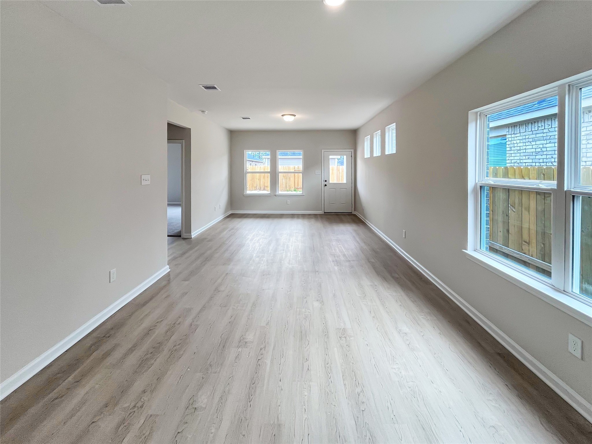 321 Stone Placa Trail Pattison, TX 77423 - Photo 7 of 19 a view of a room with wooden floor and window