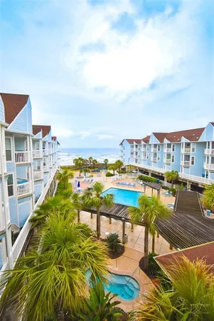 a view of a swimming pool with an ocean view