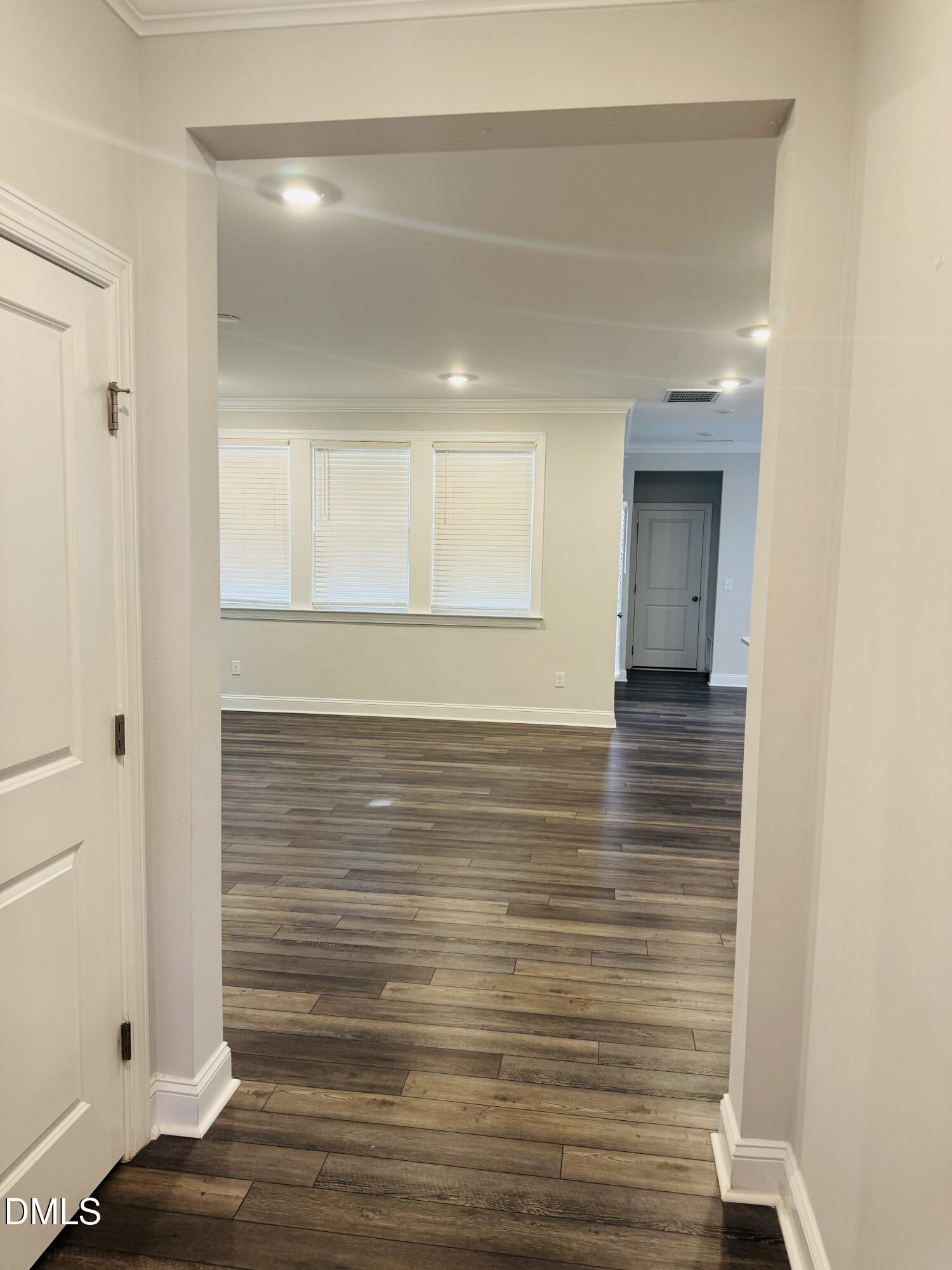 292 Edge Of Auburn Boulevard Raleigh, NC 27610 - Photo 11 of 38 a view of hallway with wooden floor