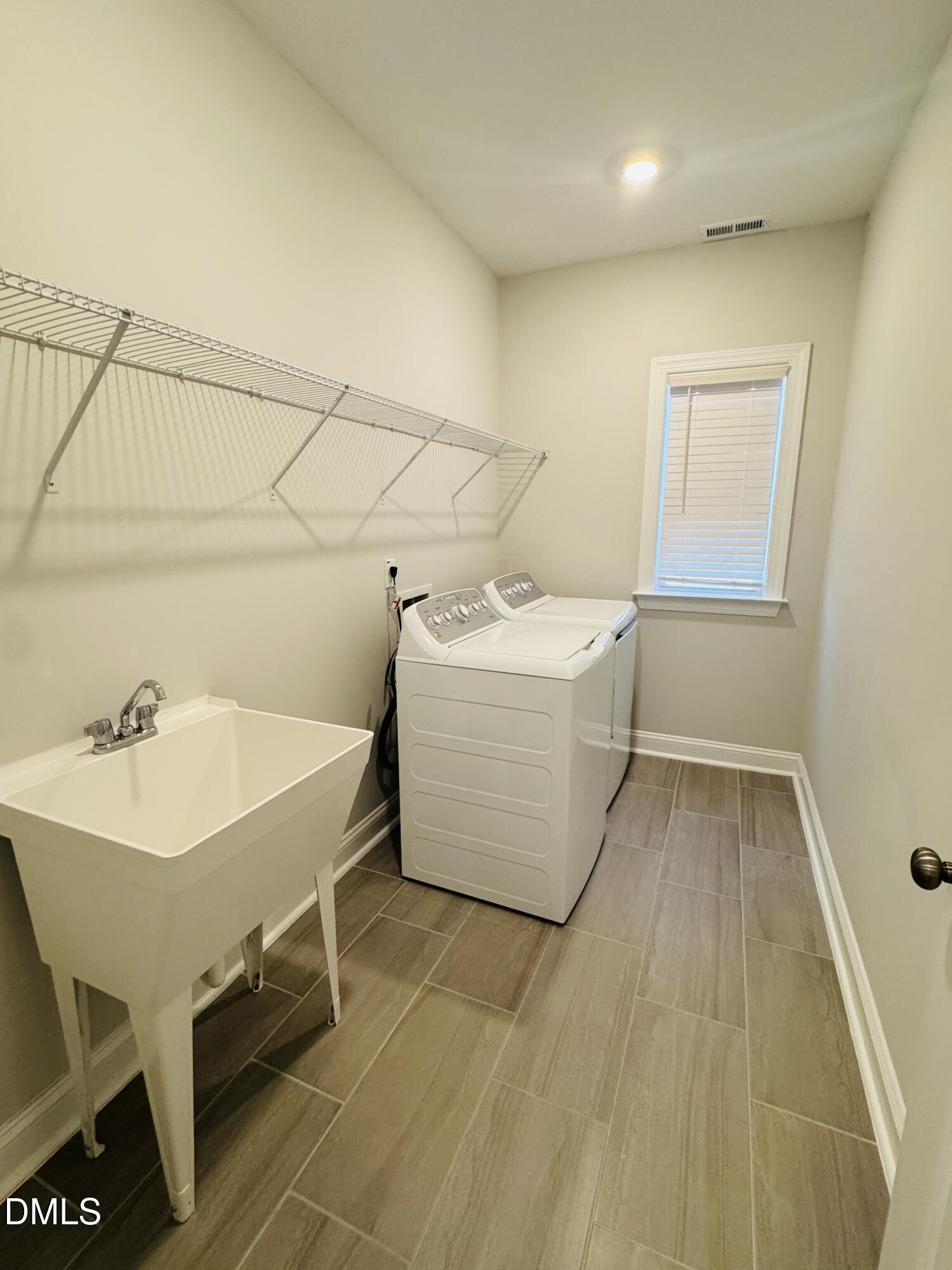 292 Edge Of Auburn Boulevard Raleigh, NC 27610 - Photo 26 of 38 a bathroom with a sink and mirror