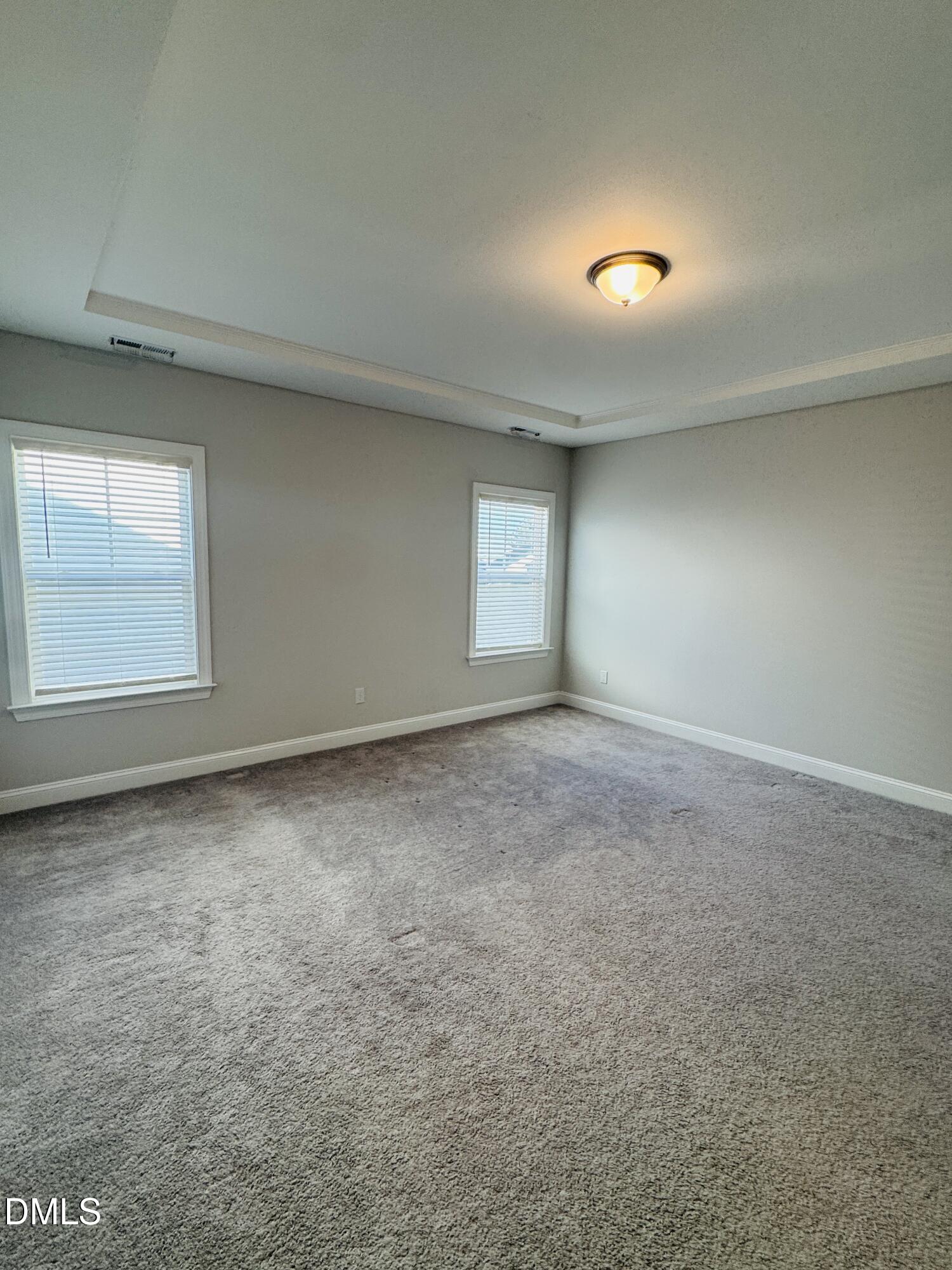 292 Edge Of Auburn Boulevard Raleigh, NC 27610 - Photo 34 of 38 an empty room with windows