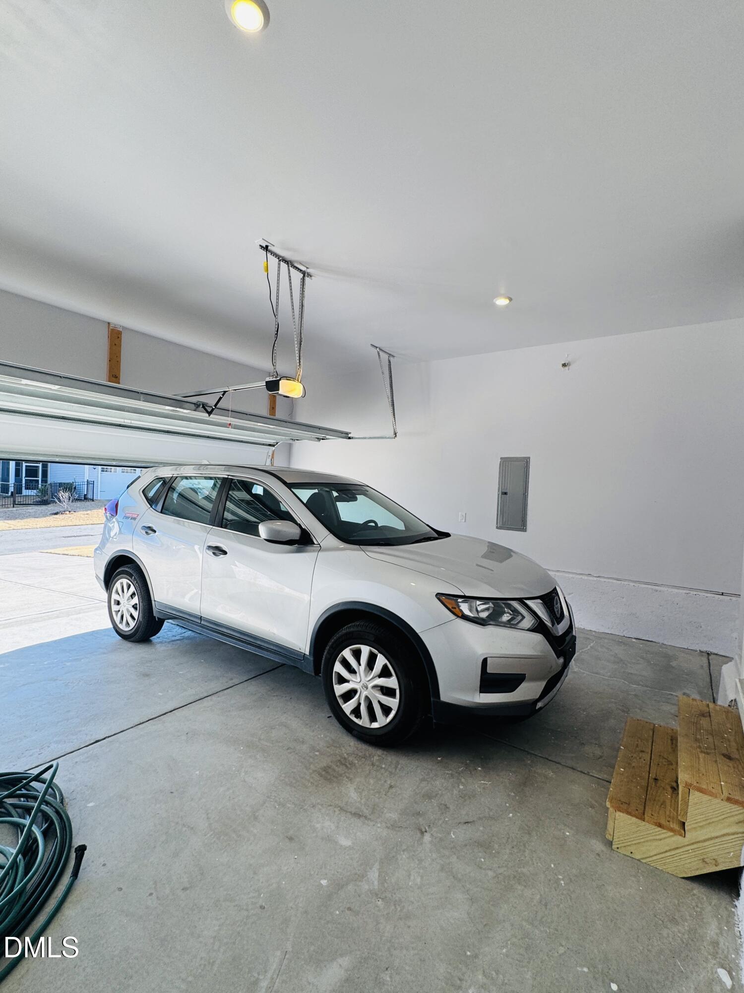 292 Edge Of Auburn Boulevard Raleigh, NC 27610 - Photo 36 of 38 a car parked in a garage