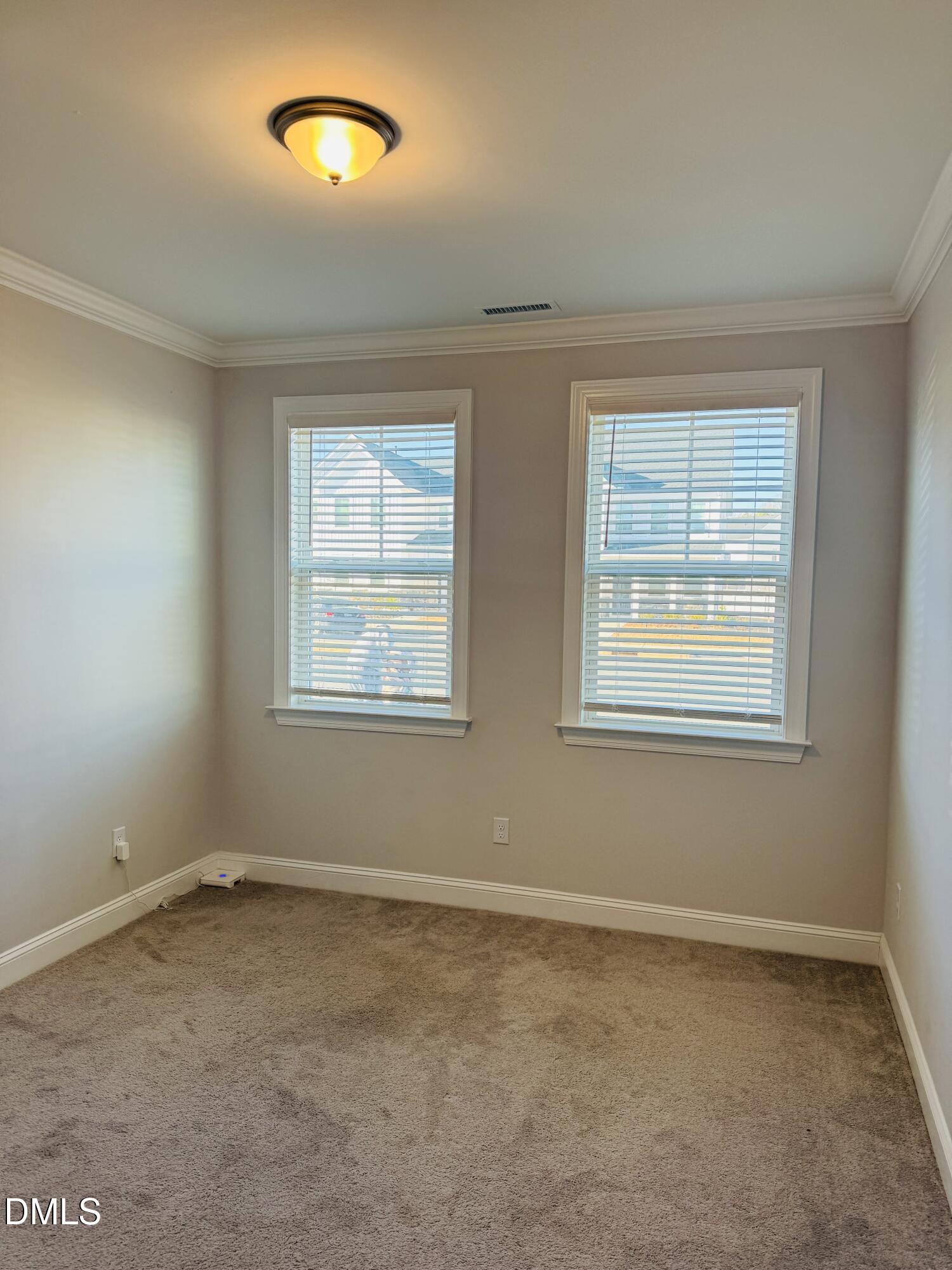 292 Edge Of Auburn Boulevard Raleigh, NC 27610 - Photo 8 of 38 an empty room with windows