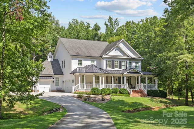 a front view of a house with yard porch and furniture
