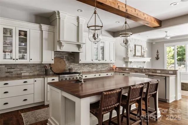 a kitchen with stainless steel appliances granite countertop a sink and cabinets