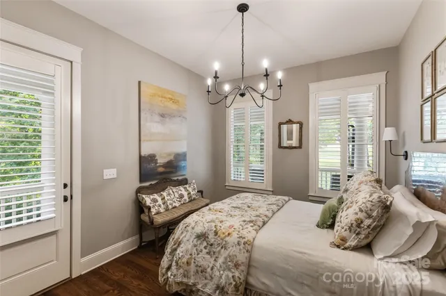 a bedroom with bed and window