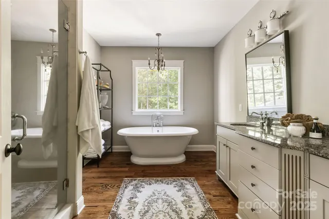a spacious bathroom with a bathtub sink and toilet