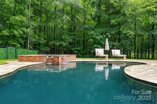a view of a house with a swimming pool