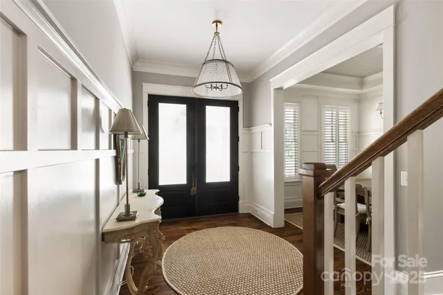 a very nice looking room with wooden floor and windows