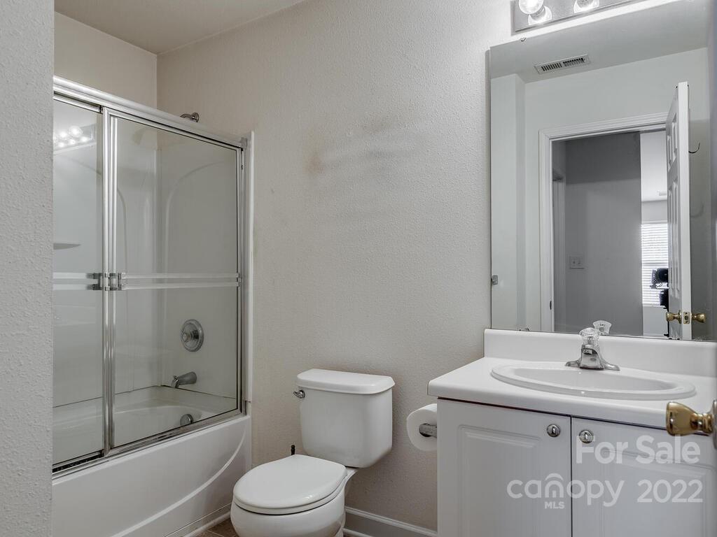 3036 Proverbs Court Monroe, NC 28110 - Photo 11 of 18 a bathroom with a sink a toilet and shower