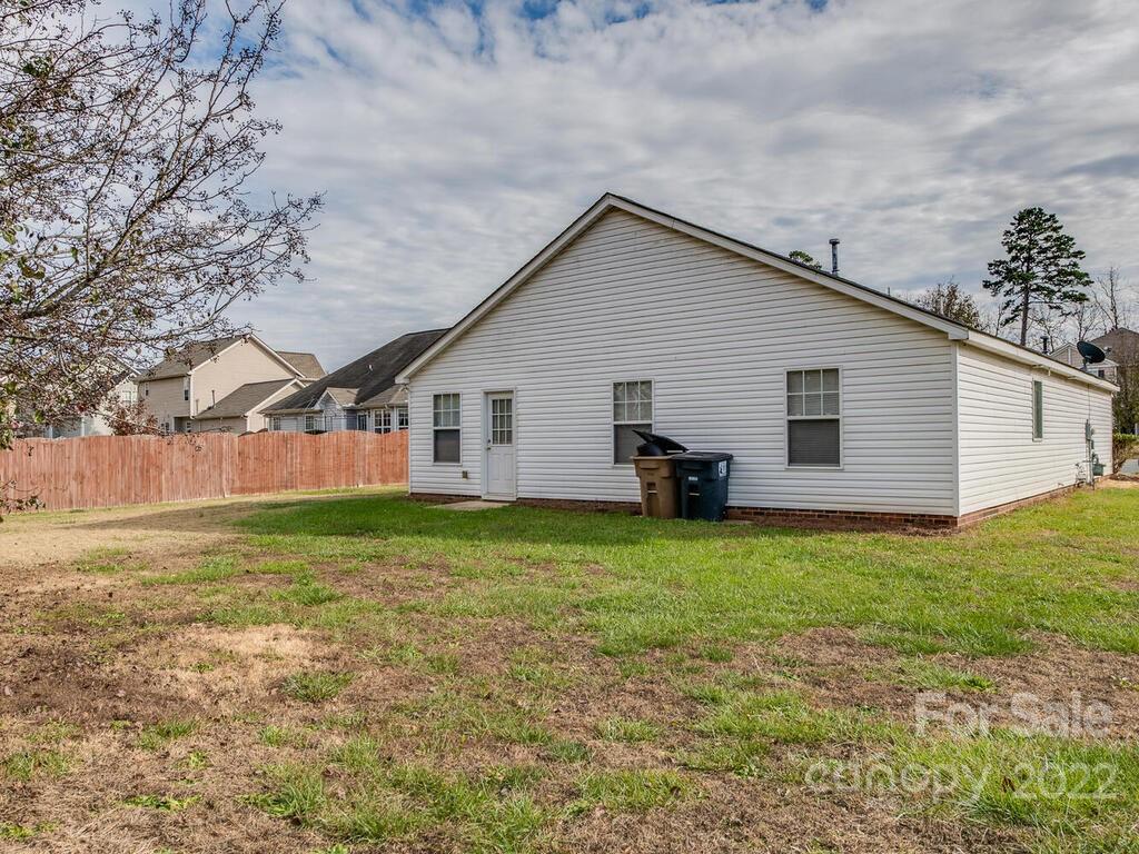 3036 Proverbs Court Monroe, NC 28110 - Photo 18 of 18 a view of a house with a yard