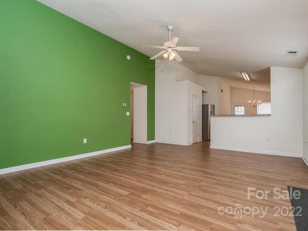 3036 Proverbs Court Monroe, NC 28110 - Photo 5 of 18 a view of an empty room with a kitchen