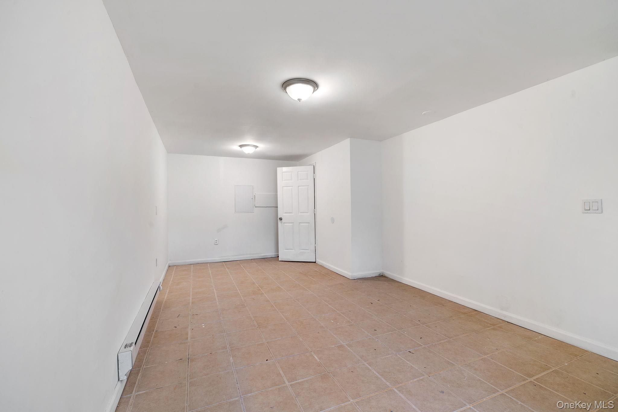 1463 Briscoe Road Swan Lake, NY 12783 - Photo 13 of 21 Spare room with baseboard heating and baseboards