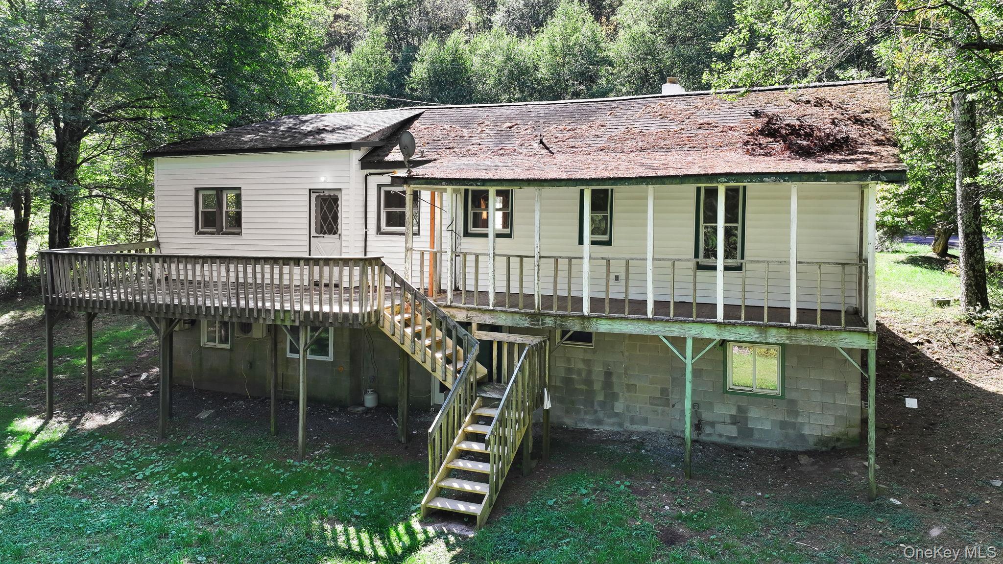1463 Briscoe Road Swan Lake, NY 12783 - Photo 19 of 21 Rear view of property featuring a deck