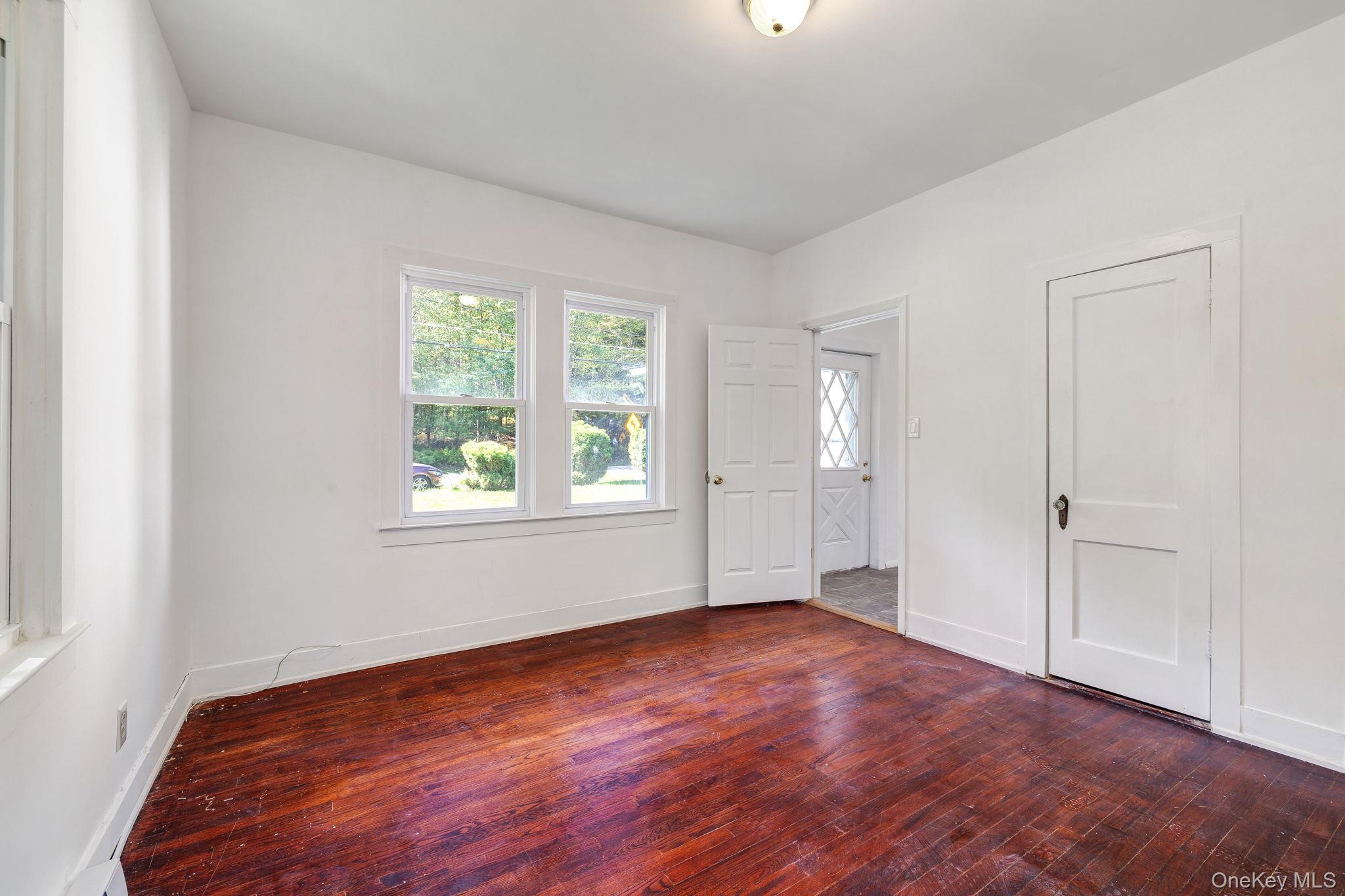 1463 Briscoe Road Swan Lake, NY 12783 - Photo 9 of 21 Unfurnished bedroom featuring wood-type flooring and baseboards