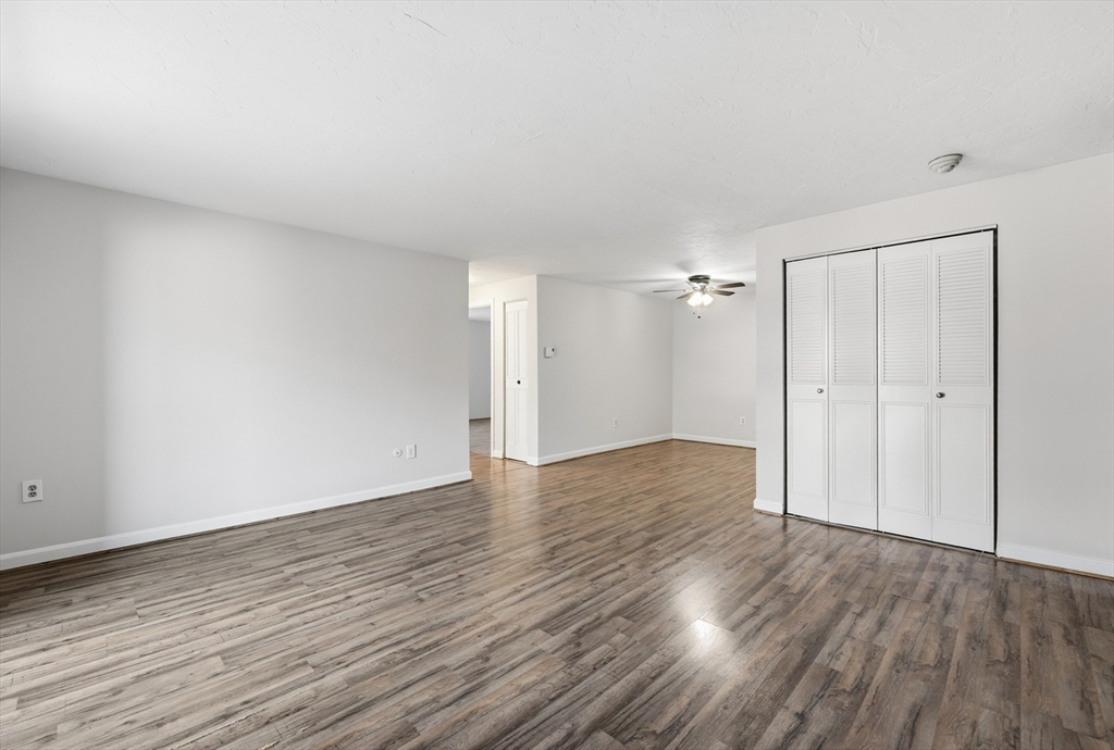 10 Mill Street, Unit Q Maynard, MA 01754 - Photo 14 of 31 wooden floor in an empty room